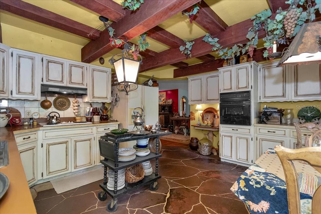 35 Magnolia Avenue Yankeetown, FL 34498 - Photo 46 of 75 a kitchen with cabinets and chairs