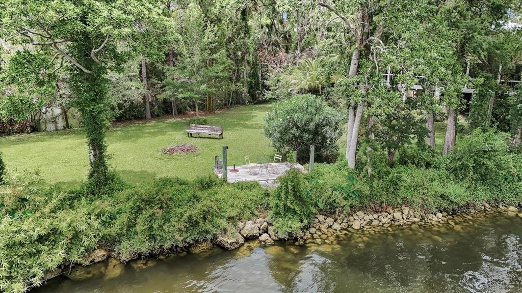 35 Magnolia Avenue Yankeetown, FL 34498 - Photo 63 of 75 a view of a garden with a lake