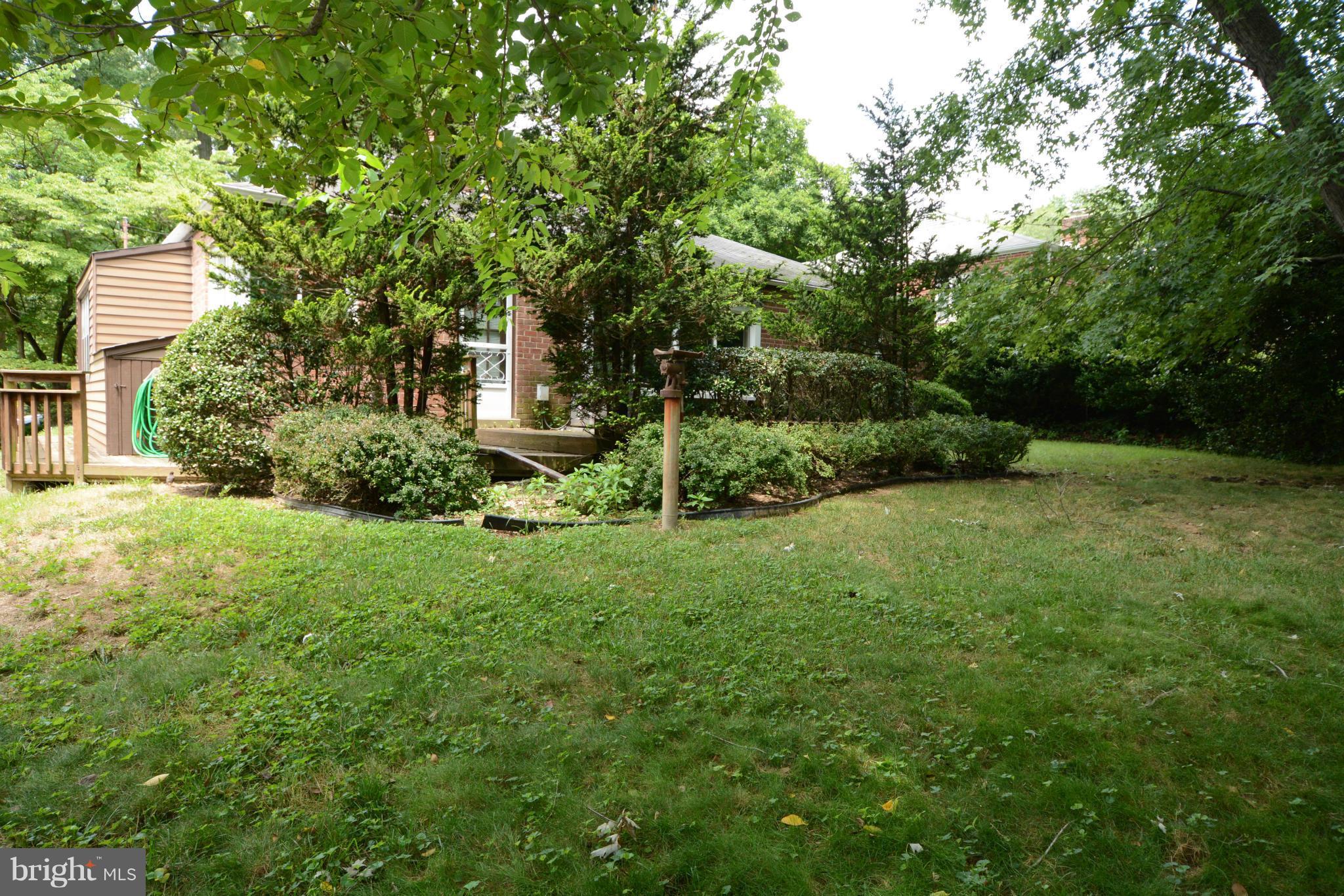 8605 Springdell Place Chevy Chase, MD 20815 - Photo 12 of 15 a view of a house with a backyard