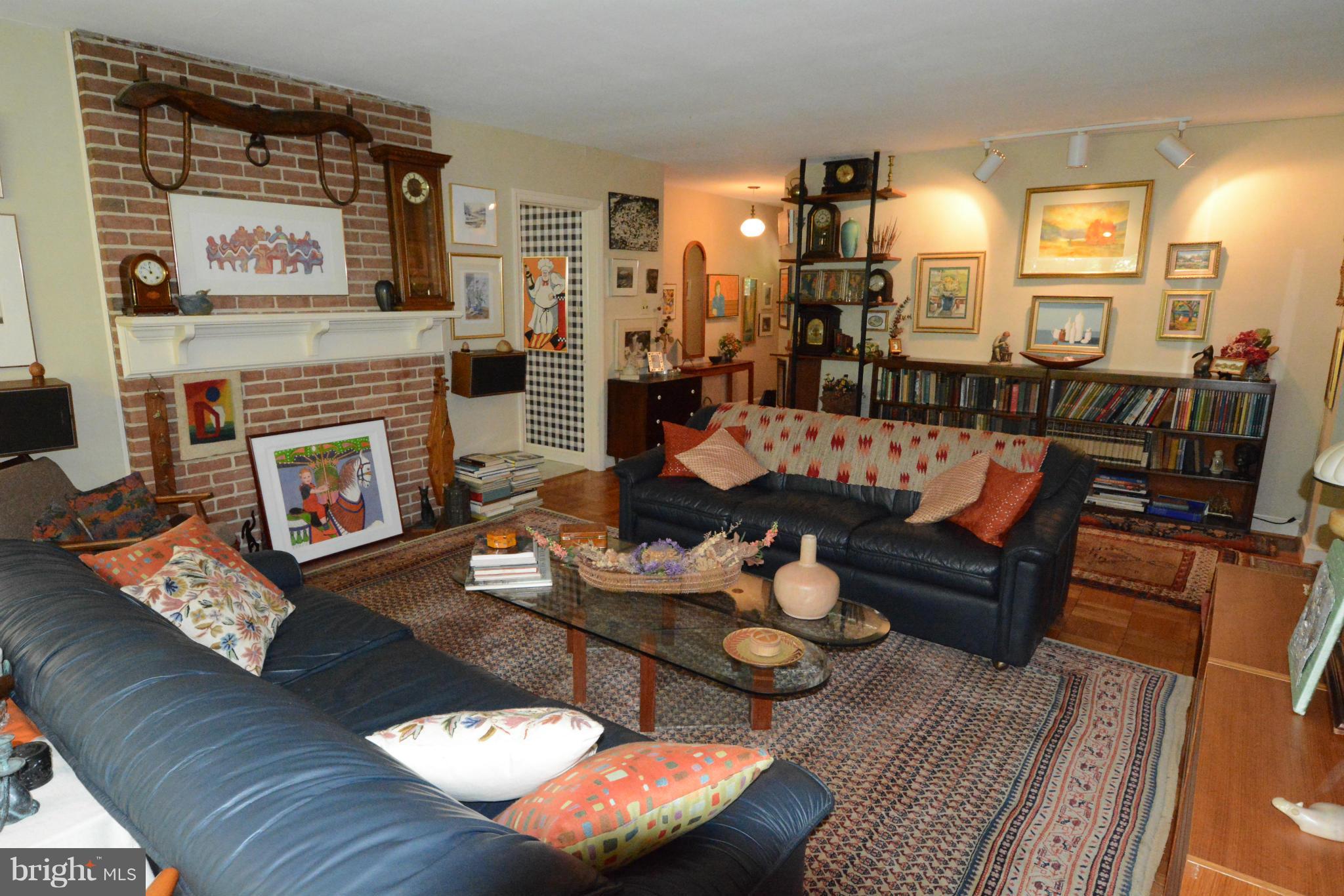 8605 Springdell Place Chevy Chase, MD 20815 - Photo 4 of 15 a living room with furniture and a fireplace