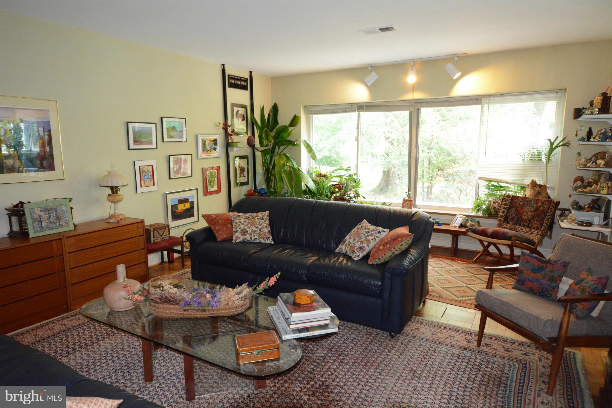 8605 Springdell Place Chevy Chase, MD 20815 - Photo 5 of 15 a living room with furniture and a large window