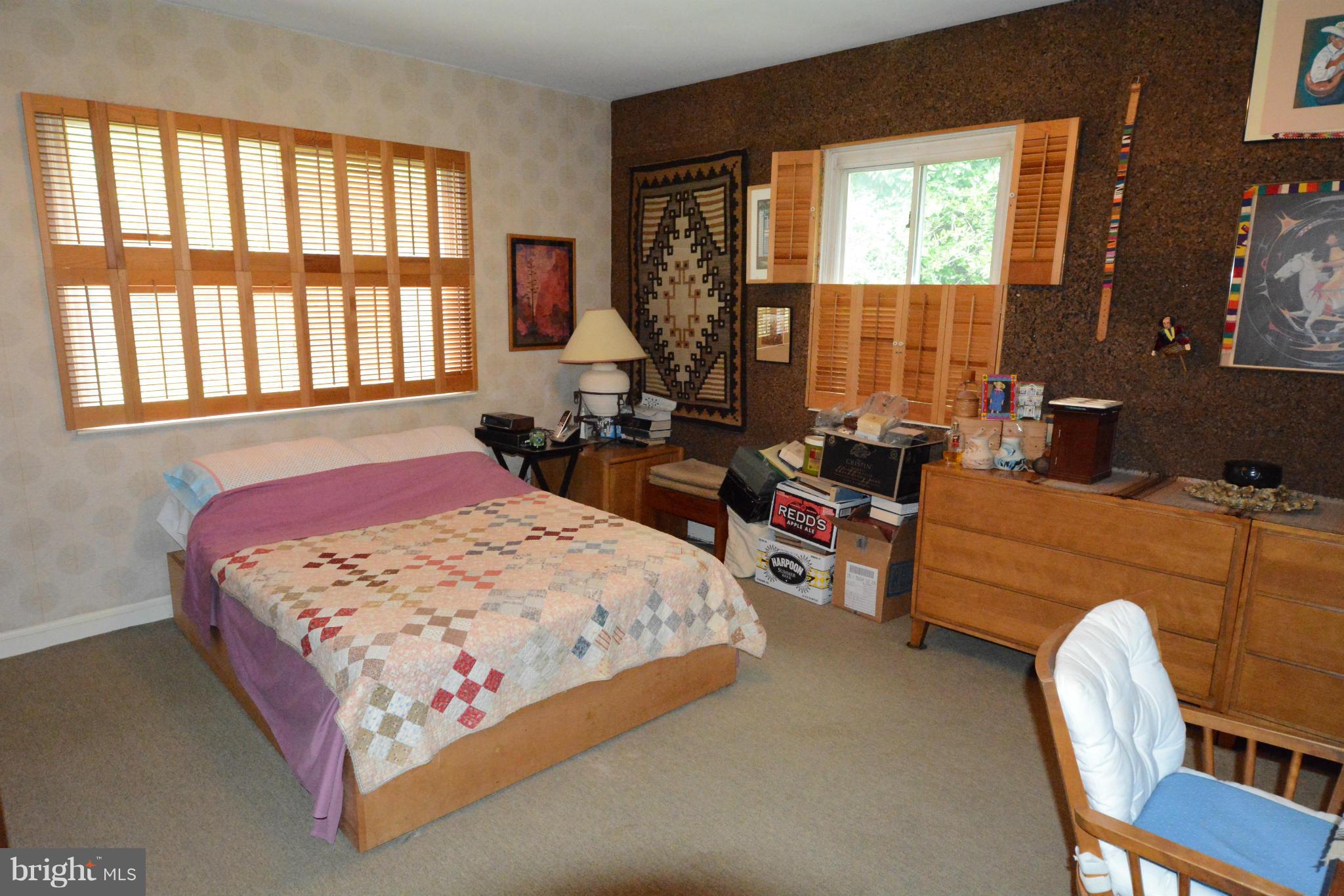 8605 Springdell Place Chevy Chase, MD 20815 - Photo 10 of 15 a bedroom with bed chair and window