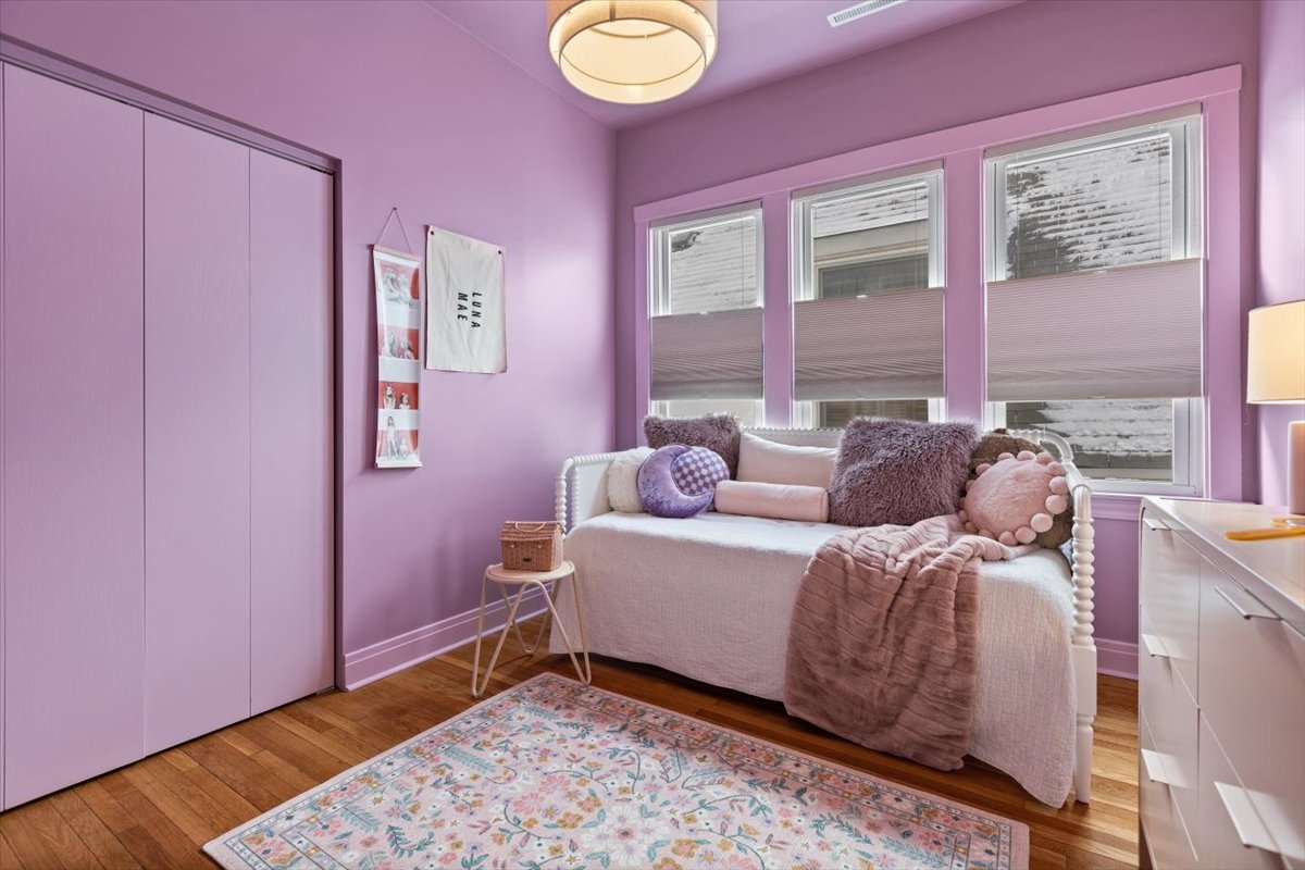 1328 West Byron Street Chicago, IL 60613 - Photo 19 of 40 a bed room with a bed and a window