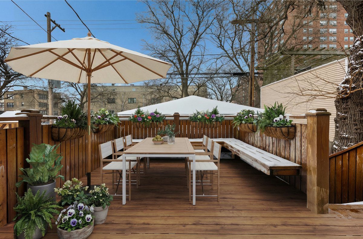 1328 West Byron Street Chicago, IL 60613 - Photo 33 of 40 a view of backyard with seating space and wooden floor