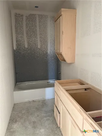 a bathroom with a sink and a bathtub