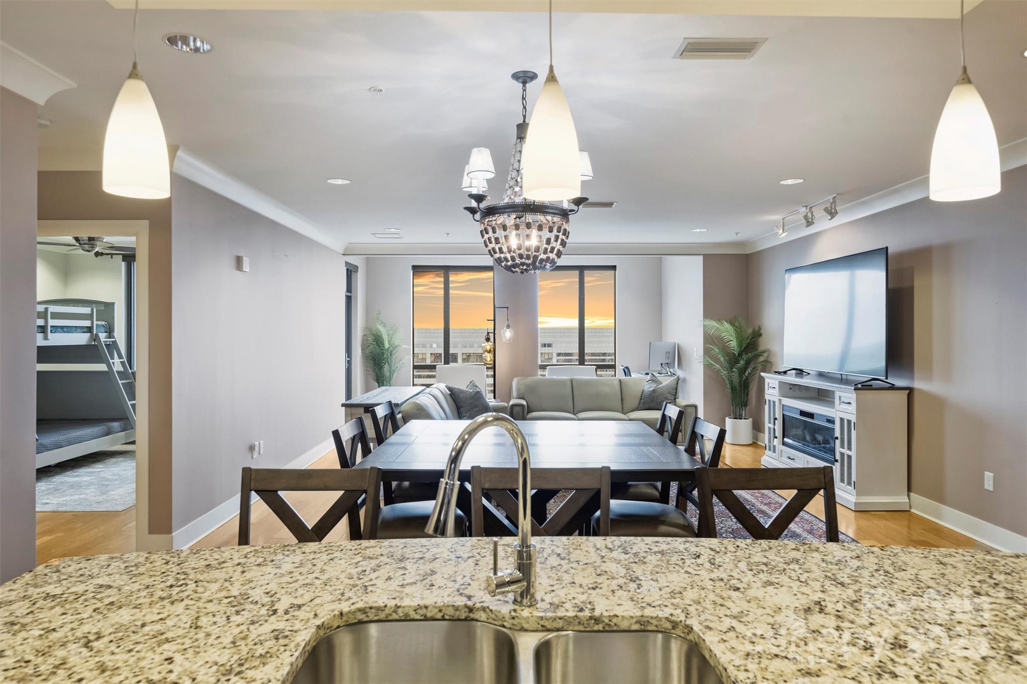 222 South Caldwell Street, Unit 1812 Charlotte, NC 28202 - Photo 14 of 37 a view of a dining room with furniture
