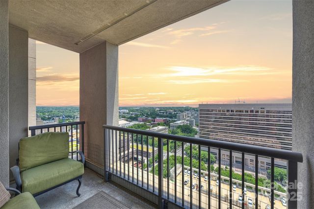 a view of a balcony with furniture