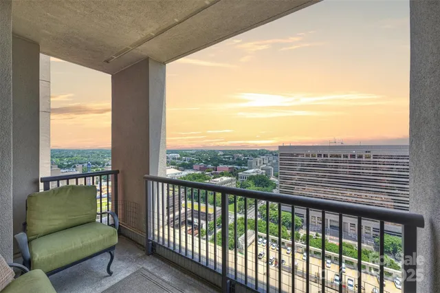 a view of a balcony with furniture