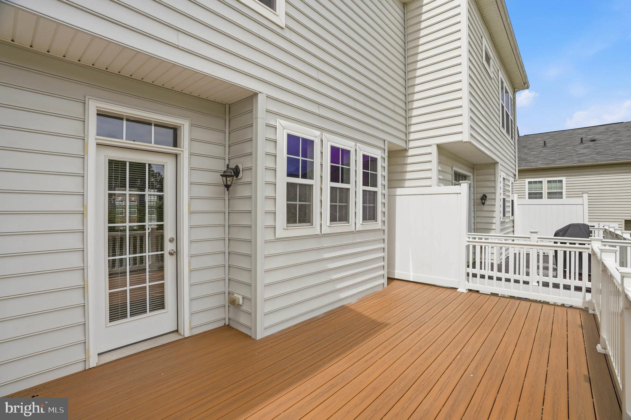 9817 Solar Course Laurel, MD 20723 - Photo 32 of 59 a view of a house with wooden deck