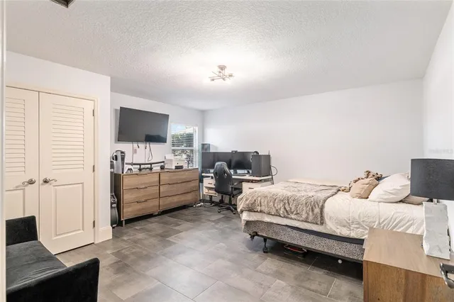 a room with a bed and furniture