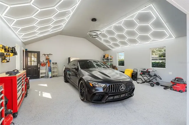 a bedroom with furniture and a chandelier