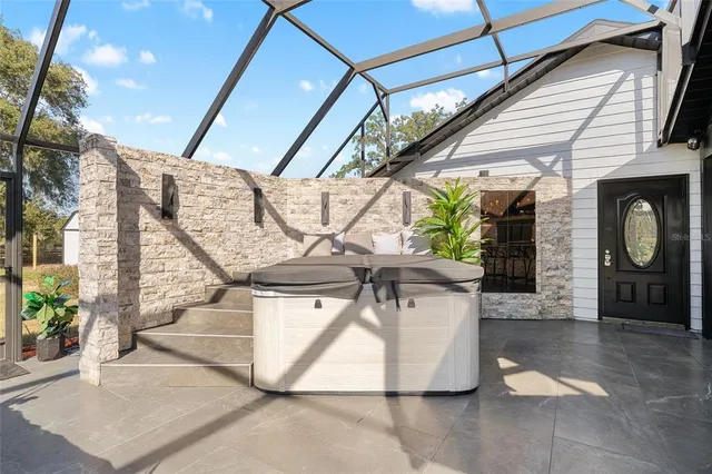 a view of a patio with table and chairs