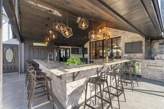 a view of a dinning table and chairs in the patio