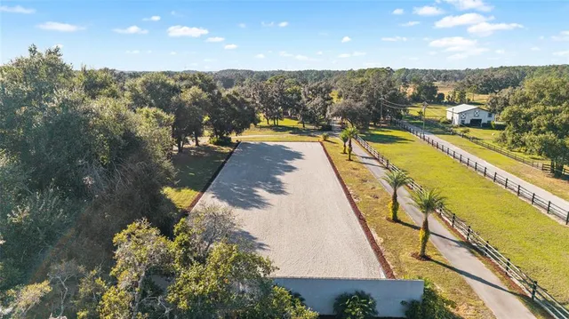 a view of a swimming pool with a lounge chair