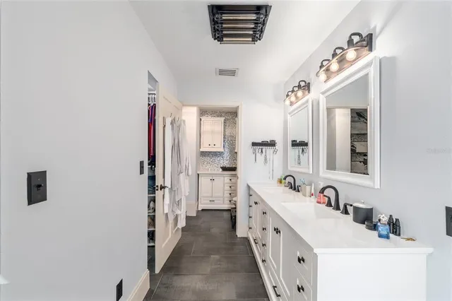 a bathroom with a sink a mirror and a bathtub