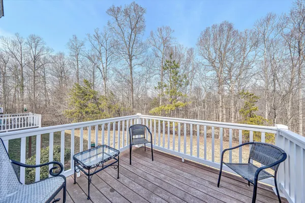 a view of a two chairs on the roof deck