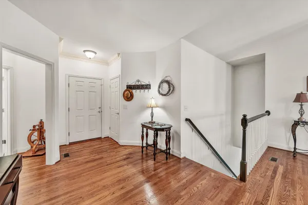 a bedroom with a bed couch and a window