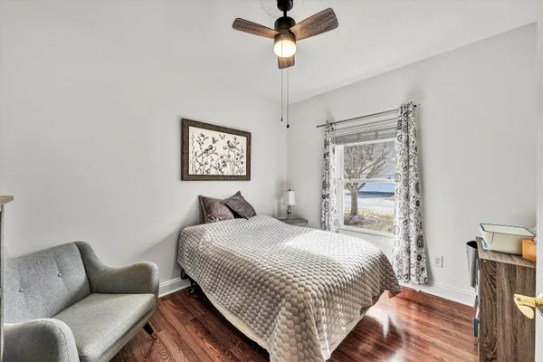 a bathroom with a sink mirror vanity and toilet