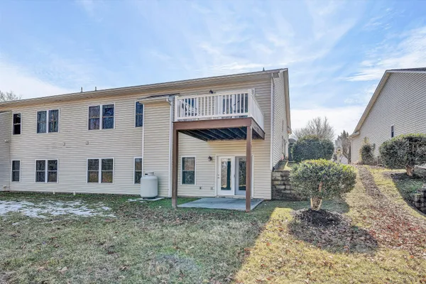 a view of a house with a backyard