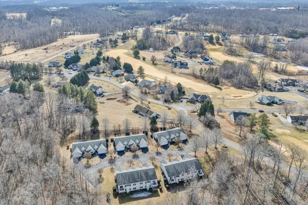 an aerial view of house with yard