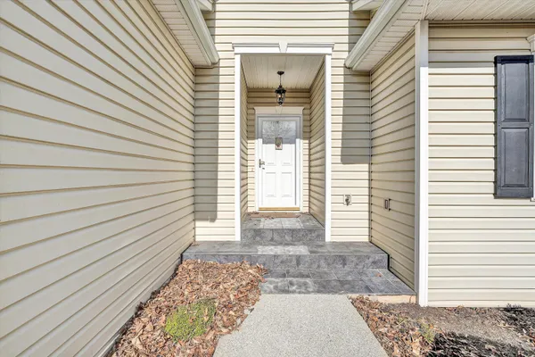 a living room with furniture and a table
