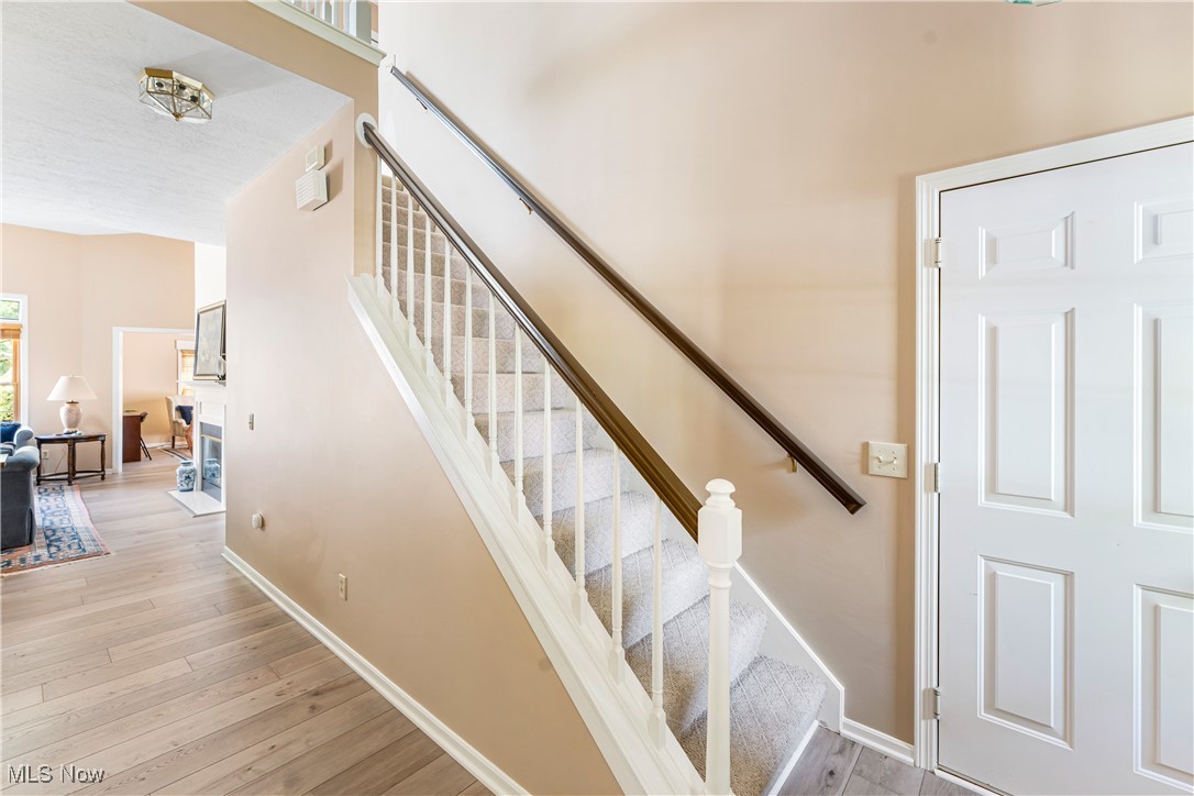 2444 Charing Cross Road Northwest Canton, OH 44708 - Photo 5 of 40 Stairway featuring wood-type flooring