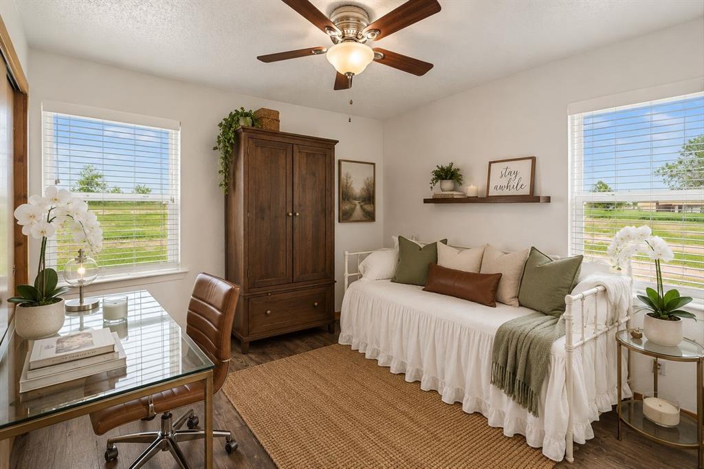 2762 West Highway 199 Springtown, TX 76082 - Photo 23 of 33 Secondary bedroom suggesting an armoire or wall unit closet for more storage and closet space. A perfect set up for home office, guest accommodation or a baby nursery. Virtually staged for potential