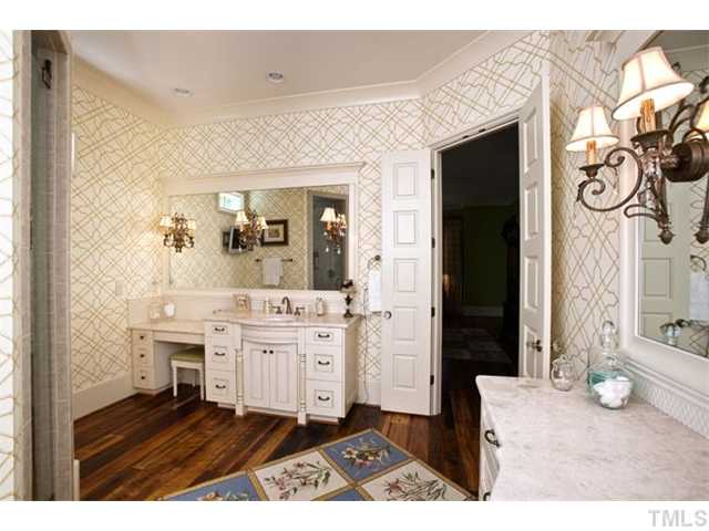 3026 Churchill Road Raleigh, NC 27607 - Photo 4 of 25 Incredible master bath with two separate sinks, walk in shower, hardwood floors, and custom vanities.