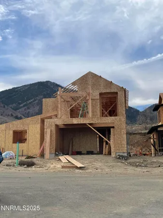 a view of a house with a yard and garage