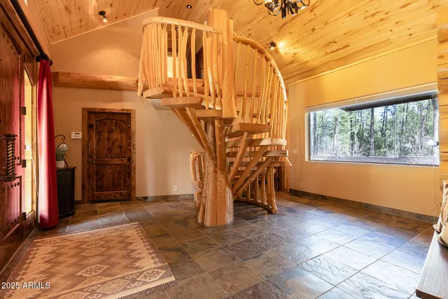 a large kitchen with stainless steel appliances granite countertop a sink and a stove