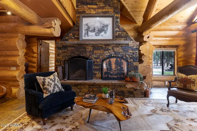 a dining room with furniture and a chandelier