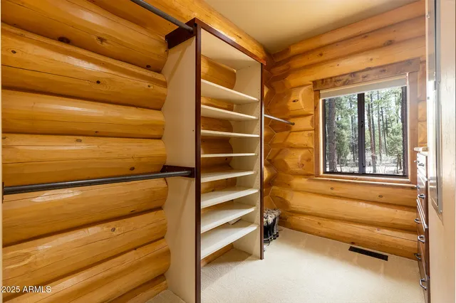 a lobby with furniture and a gate