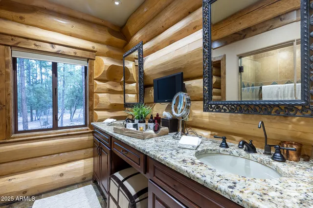 a bathroom with a tub sink and toilet