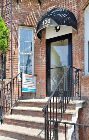 a front view of a house with a porch