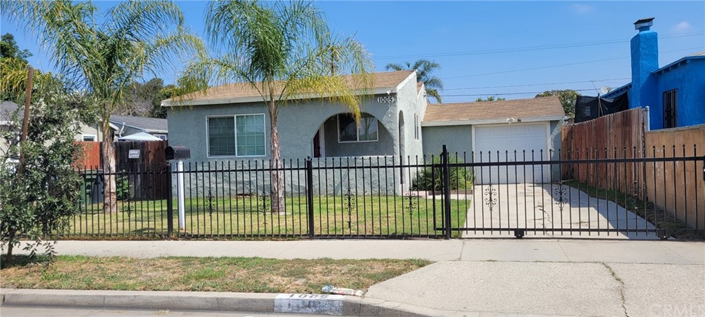 a view of a wrought iron fences in front of house