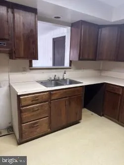 a bathroom with a sink and mirror