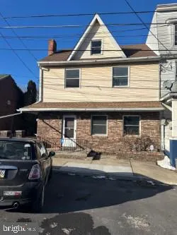 a front view of a house with parking