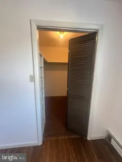 a bathroom with a toilet and a bathtub