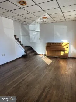 a view of a room with wooden floor