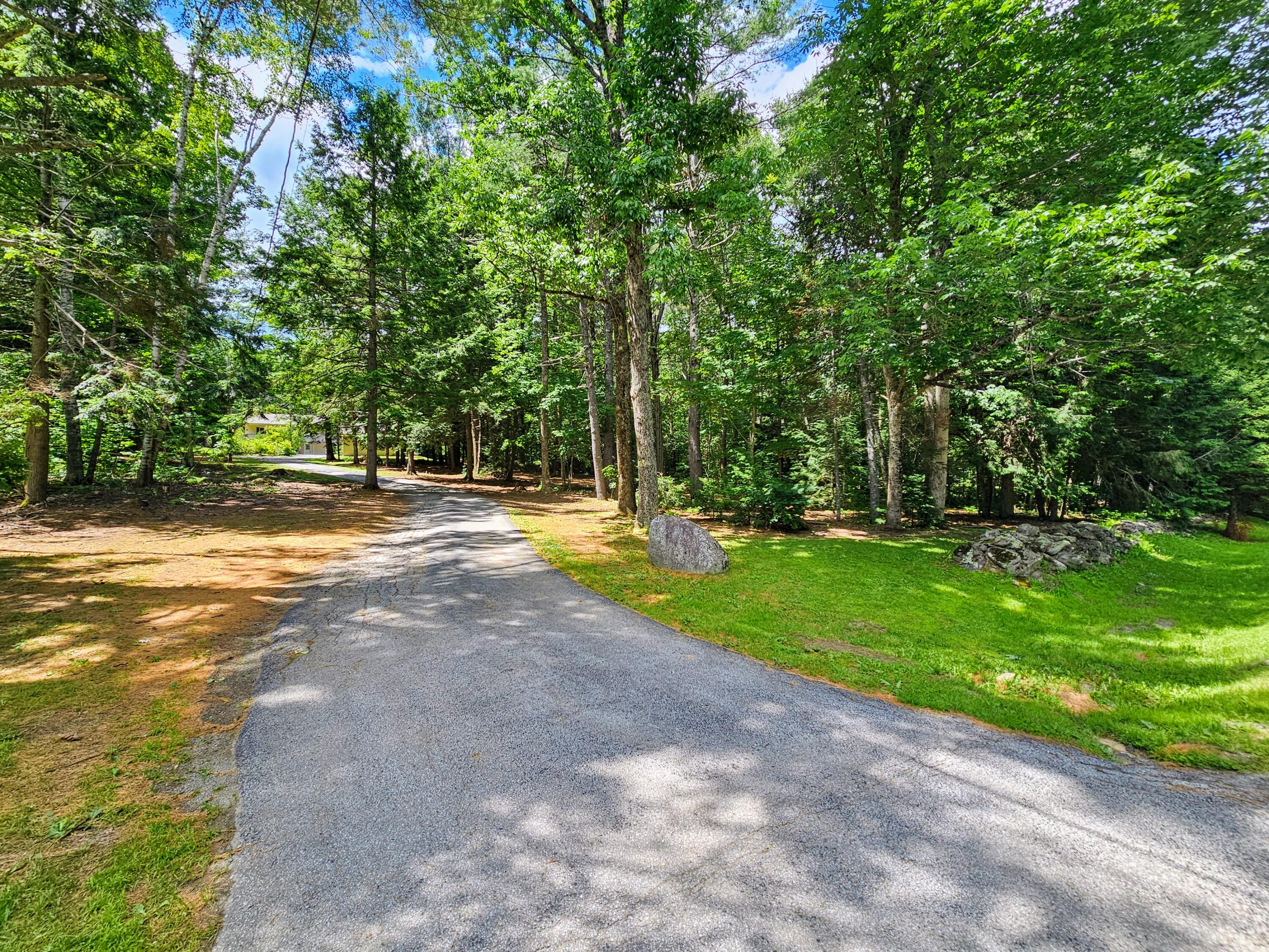 191 Chapman Road Newburgh, ME 04444 - Photo 2 of 23 Driveway and rock wall