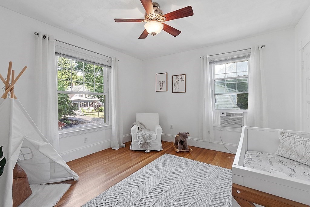 70 Park Avenue Stoneham, MA 02180 - Photo 17 of 36 a bedroom with furniture and a window