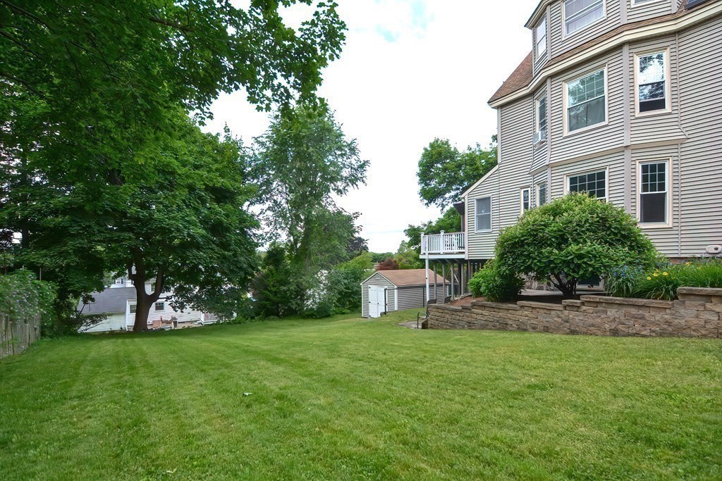 70 Park Avenue Stoneham, MA 02180 - Photo 30 of 36 a view of a house with a yard and tree s