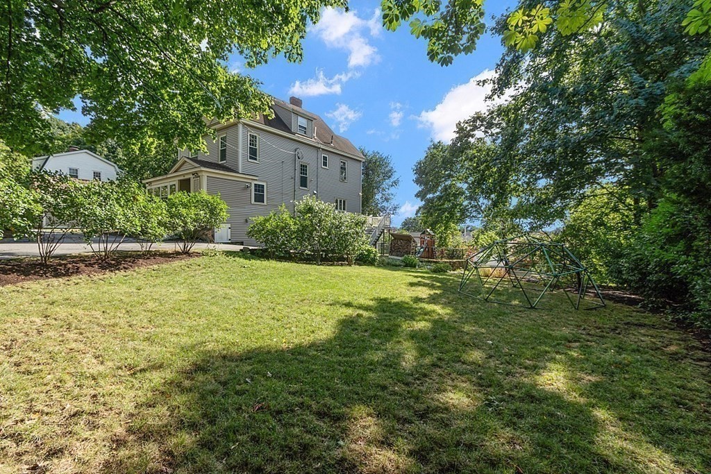 70 Park Avenue Stoneham, MA 02180 - Photo 31 of 36 a view of a big yard with plants and large trees