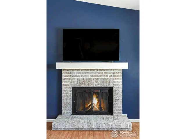 a living room with a fireplace and a fireplace