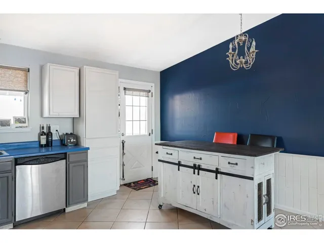 a kitchen with cabinets and window