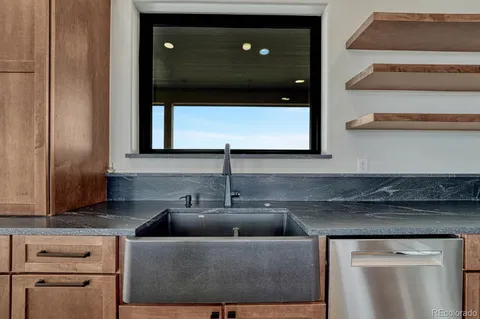 a kitchen with a sink and cabinets