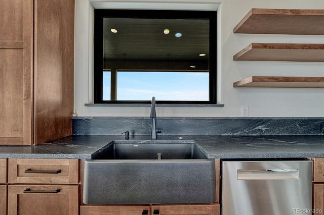 a kitchen with a sink and cabinets