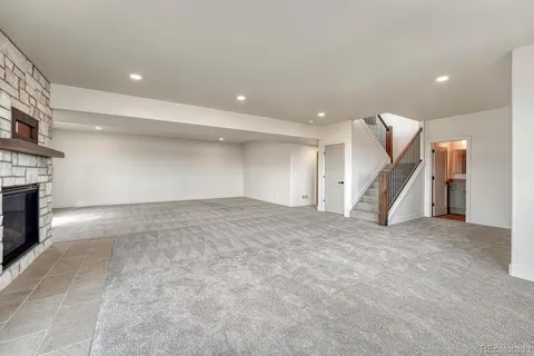 a view of an empty room with a fireplace