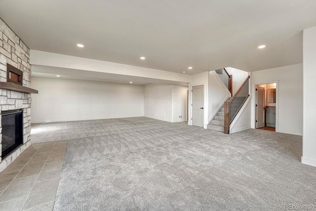 a view of an empty room with a fireplace