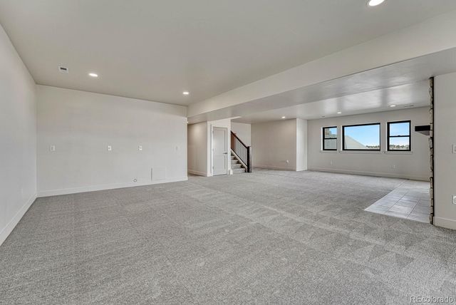 a bathroom with a toilet sink vanity and mirror